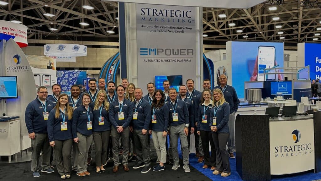 Strategic marketing team at a trade show with branded clothing